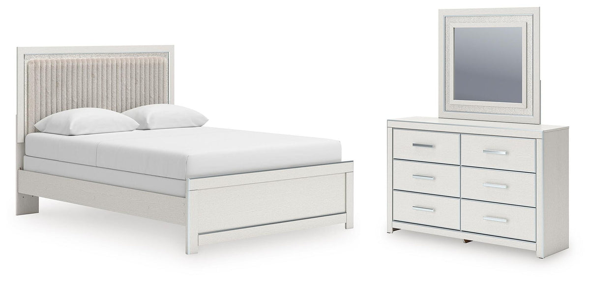 Upholstered panel bed in light finish with white mattress and matching dresser and mirror