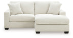 White sofa chaise with two back cushions and a curved chaise ottoman base