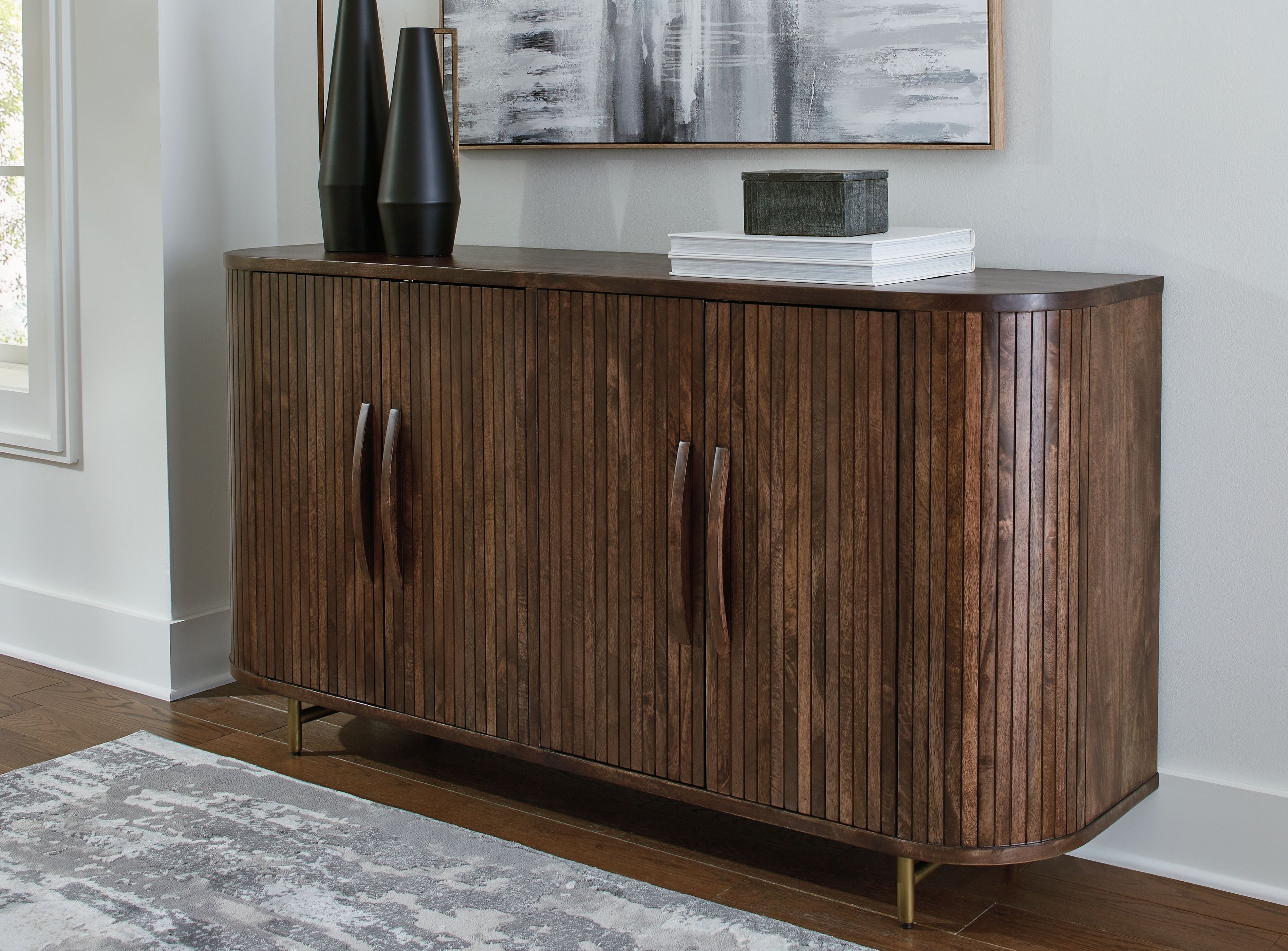 Dark brown accent cabinet with vertical doors, curved corners, and gold-toned legs