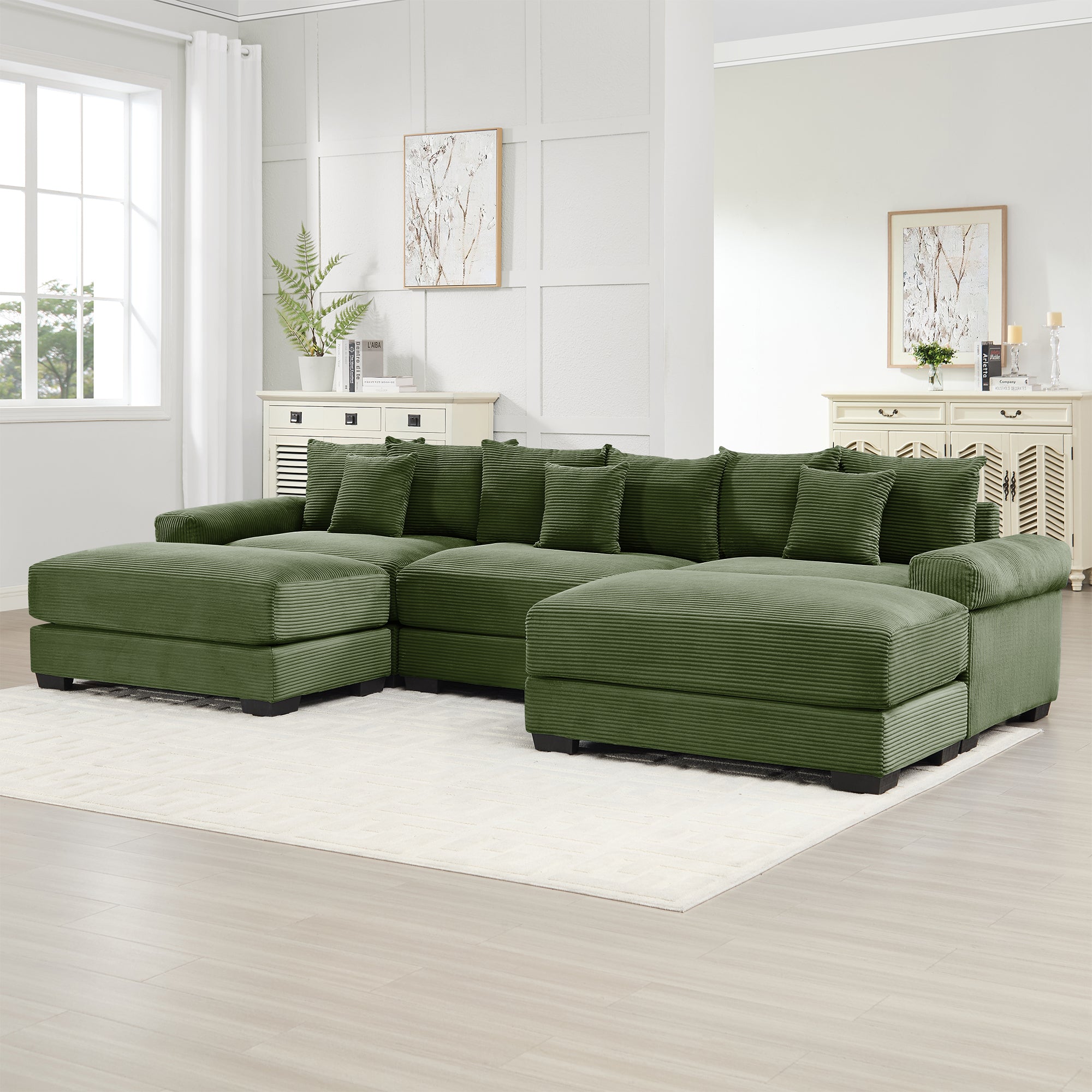 Green modular corduroy sectional sofa with back cushions and ottoman chaise