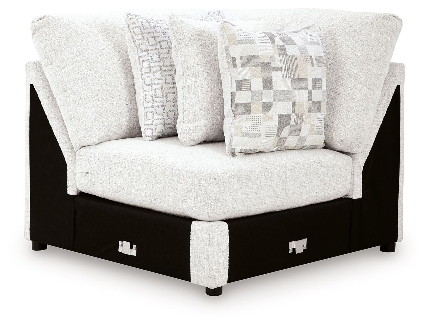 Chalk white wedge sofa with patterned accent pillows and dark wood legs