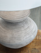 Distressed white table lamp base with curved layered texture