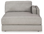 Light gray upholstered corner chaise with rounded back and track-style arms