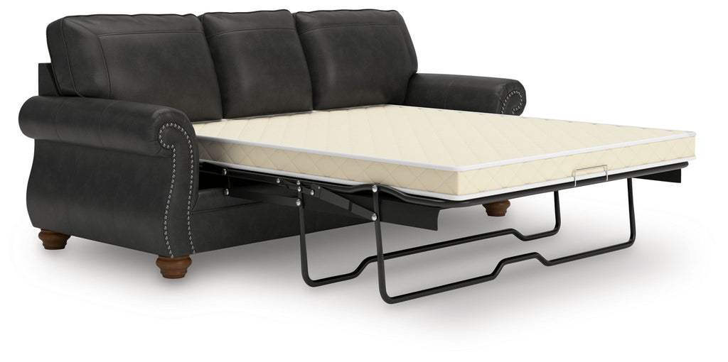 Dark gray sofa sleeper with pull-out mattress base and tufted back cushions