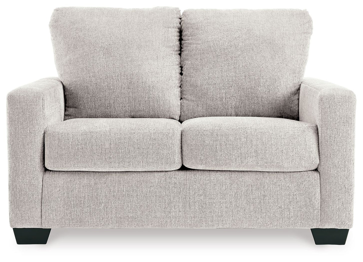 Light beige sofa sleeper with two seat cushions and three back cushions