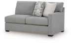 Pewter gray RAF sofa with boxy arms, tufted cushions, and two decorative patterned pillows