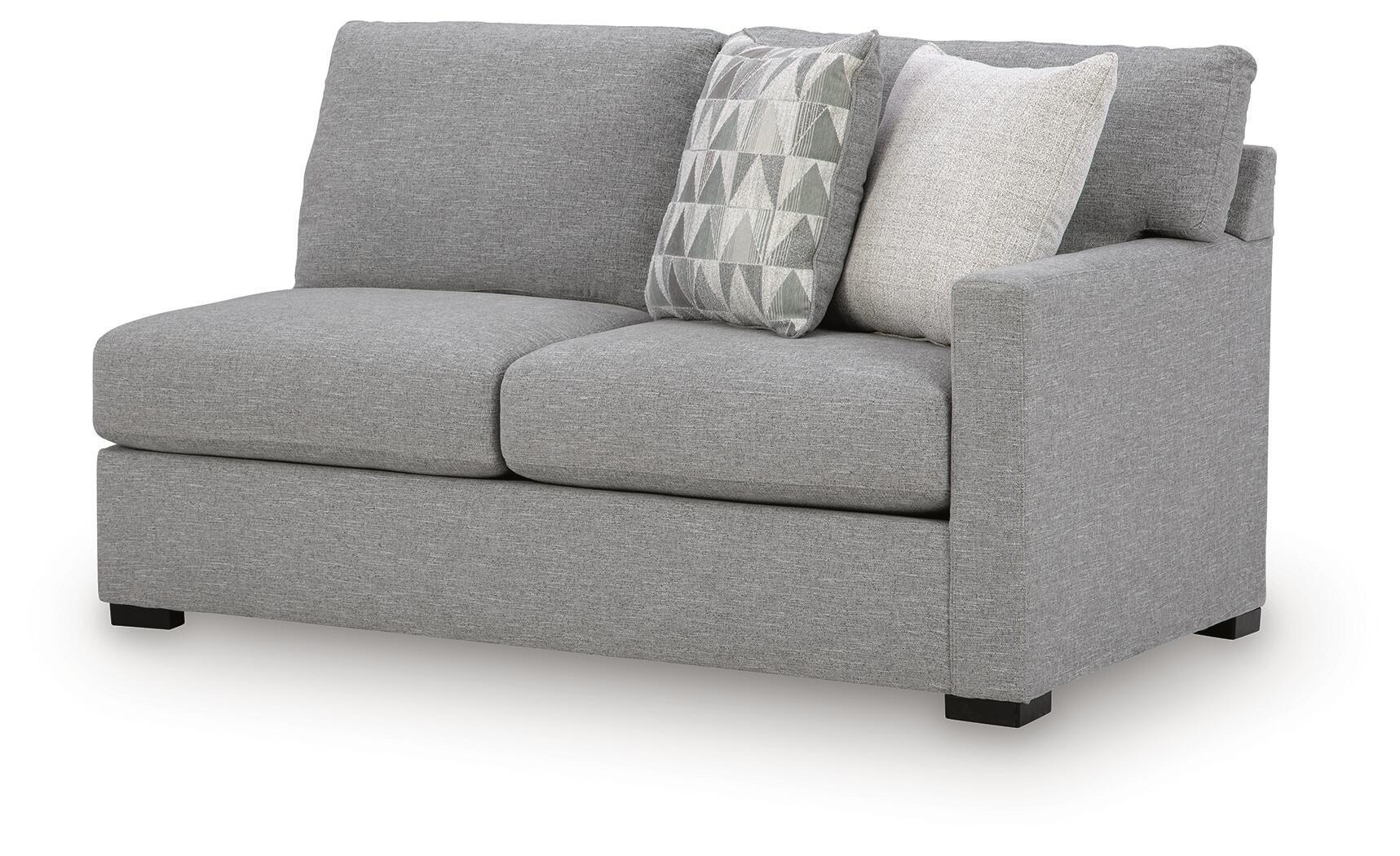 Pewter gray RAF sofa with boxy arms, tufted cushions, and two decorative patterned pillows