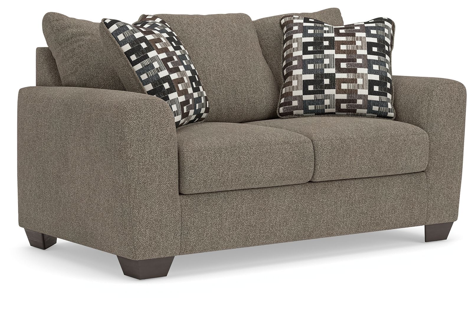 Grey suede loveseat with two patterned throw pillows and cushioned seat