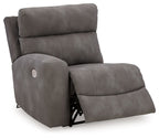 Slate gray power recliner chair with padded headrest, curved arms, and extended footrest