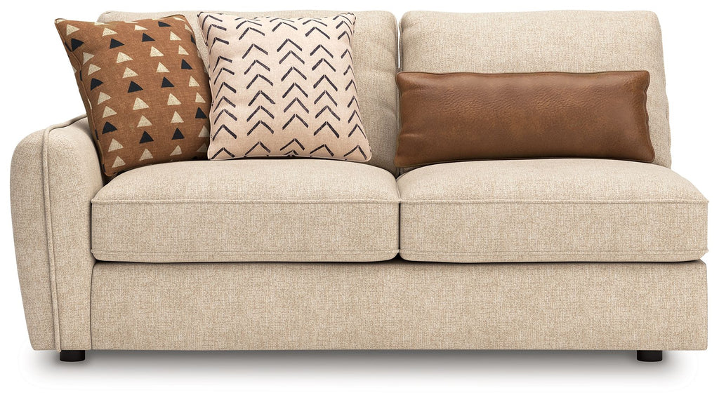 Sand LAF sofa with light beige upholstery and three decorative pillows, wide seat cushions.