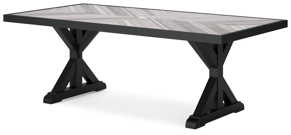 Rectangular dining table with black cross-legs and light gray tabletop