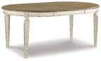 Oval dining extension table with chipped white legs and wood-look oval tabletop