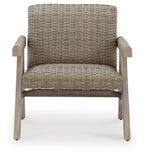 Beige woven rocking lounge chair with cushioned seat and padded wooden arms