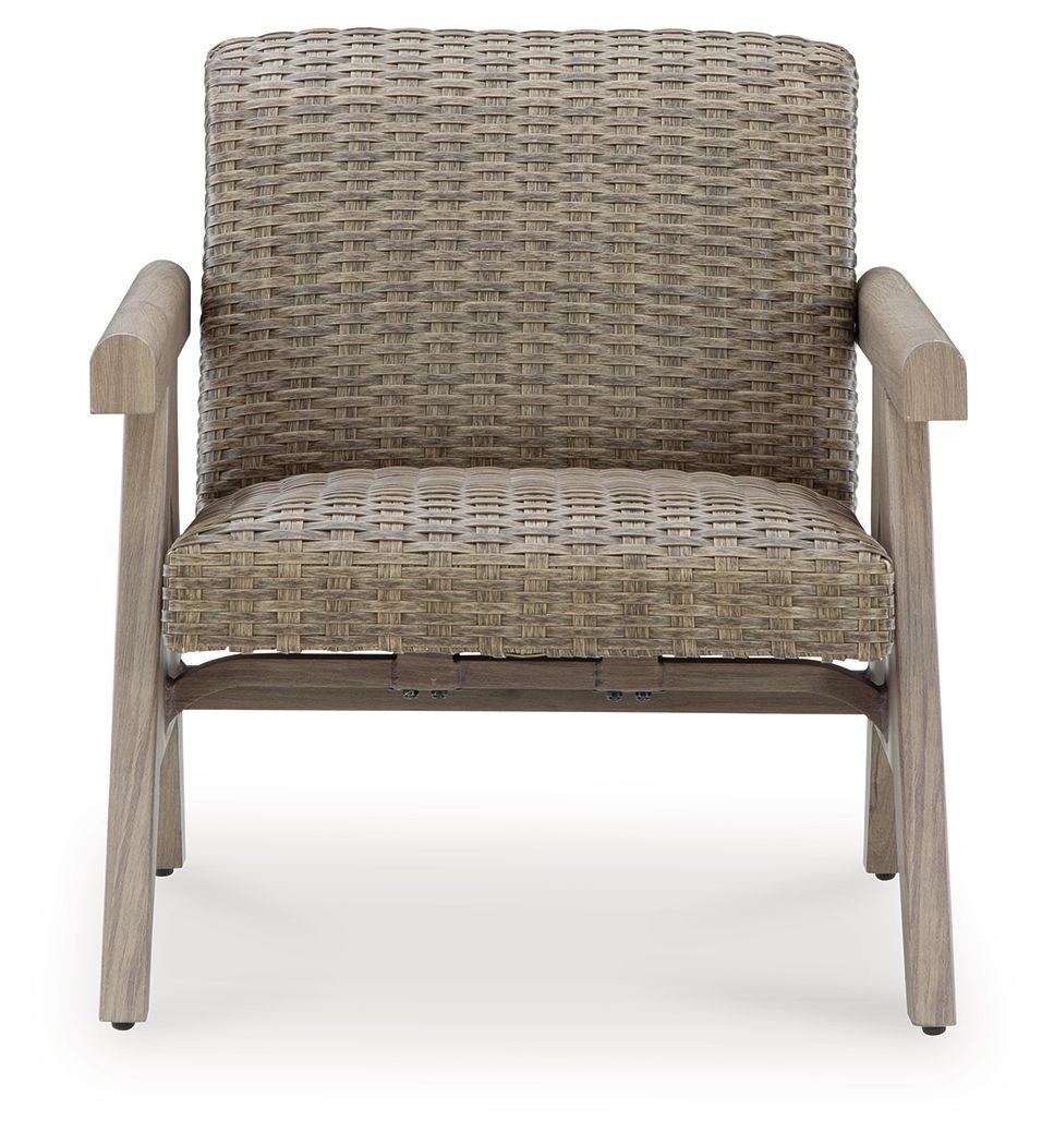 Beige woven rocking lounge chair with cushioned seat and padded wooden arms