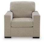 Light gray upholstered accent armchair with square arms and cushioned backrest