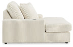 Corduroy chaise lounge chair in off-white with side arm panel and two back cushions.