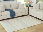 Light blue and white low-pile rug with worn stripe details and textured weave