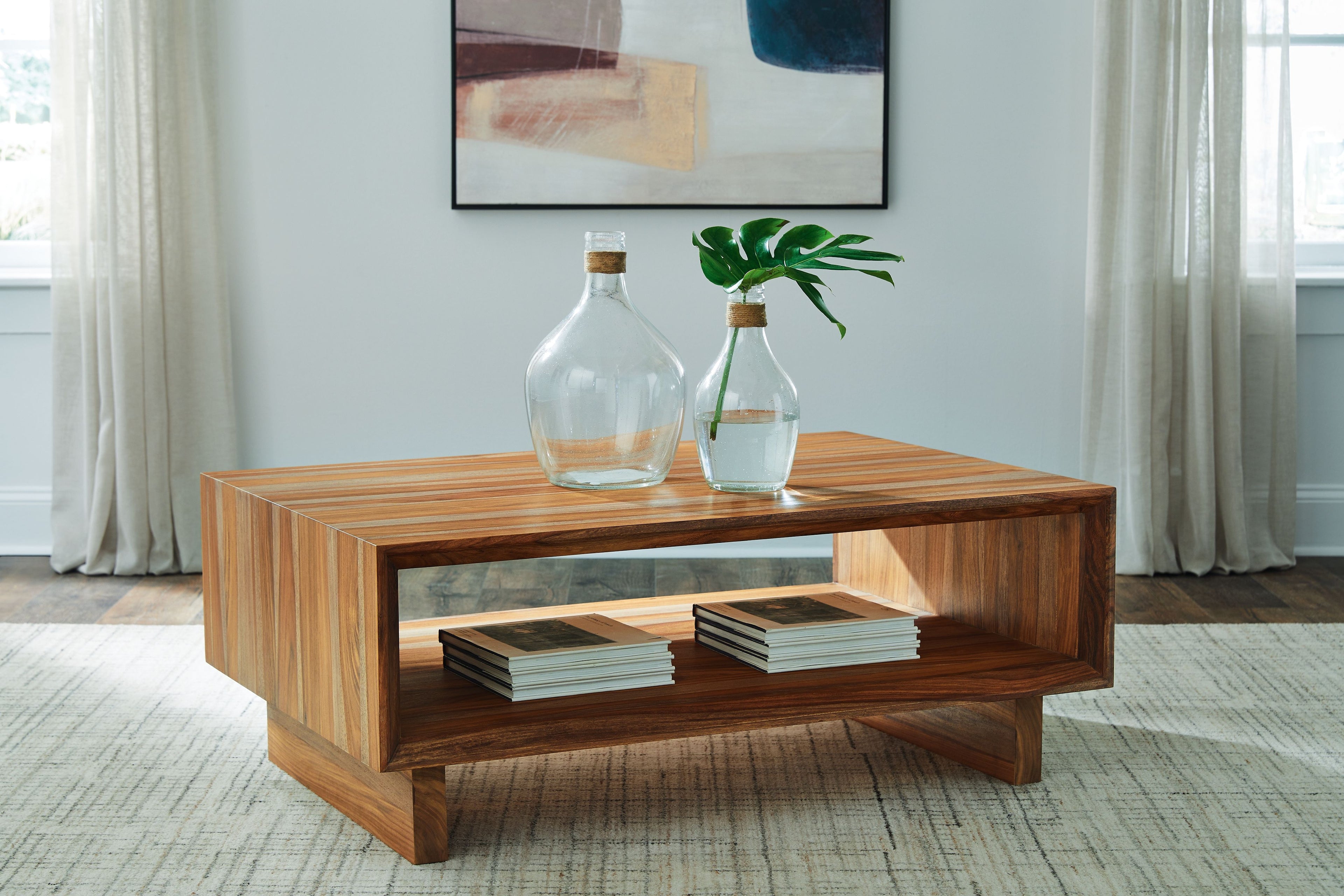 Brown rectangular cocktail table with open lower shelf and sturdy legs