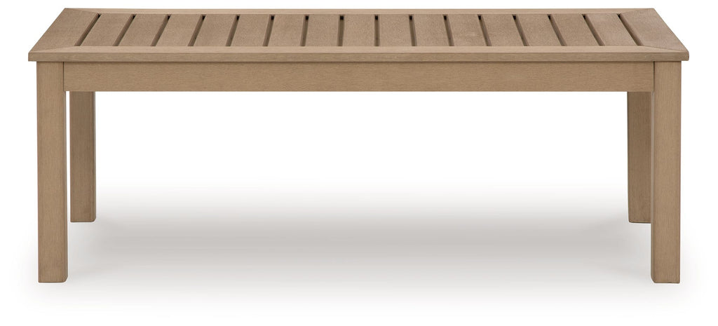 Rectangular driftwood cocktail table with slatted top and straight wooden legs.