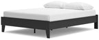 White mattress on a black platform bed frame with short tapered legs