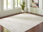Light beige rug with textured speckled surface and simple border