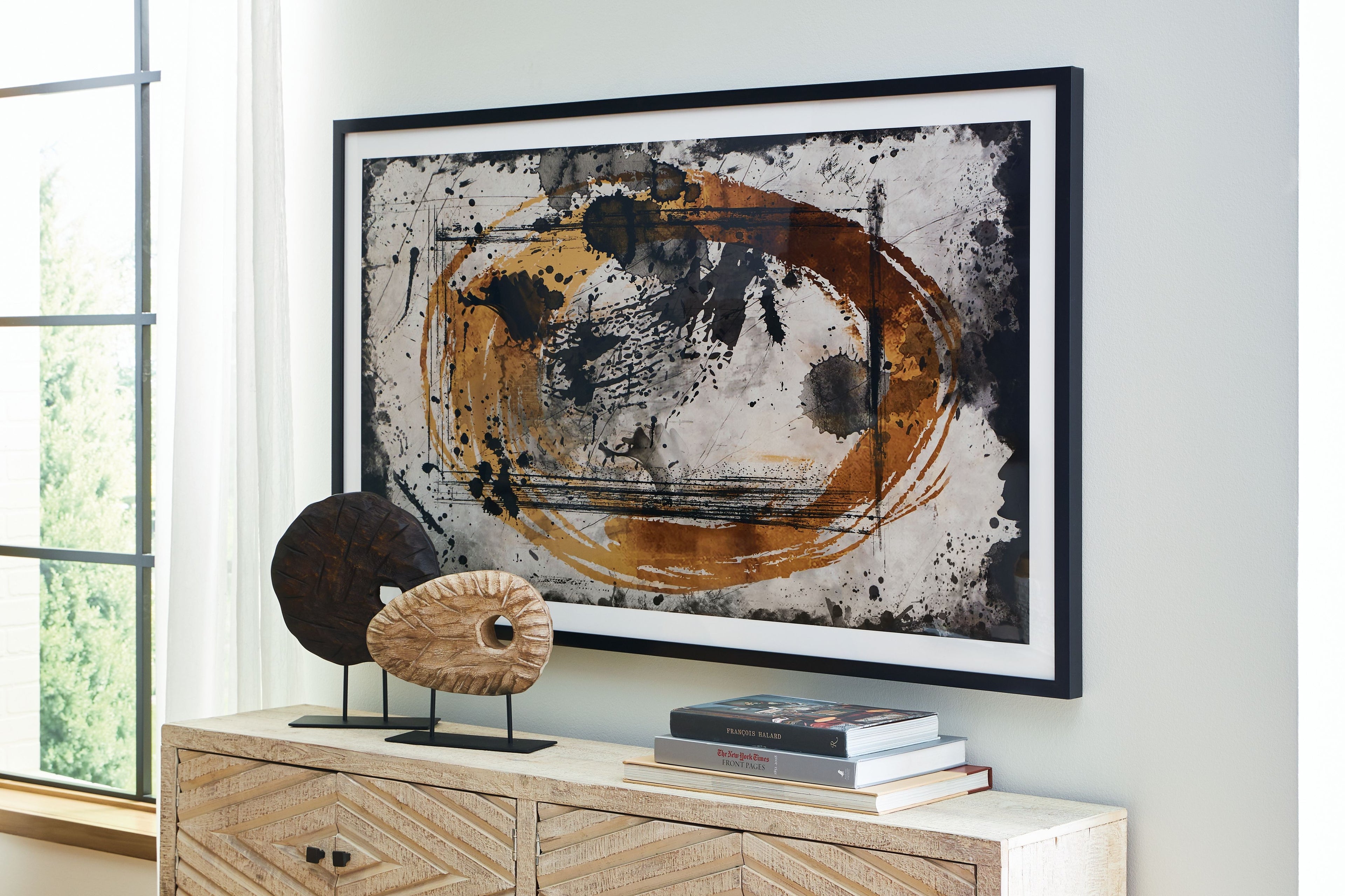 Framed abstract wall art print with black, caramel, and tan circle-like brush design