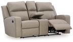 Pebble reclining loveseat with console, extended footrests and padded headrests.