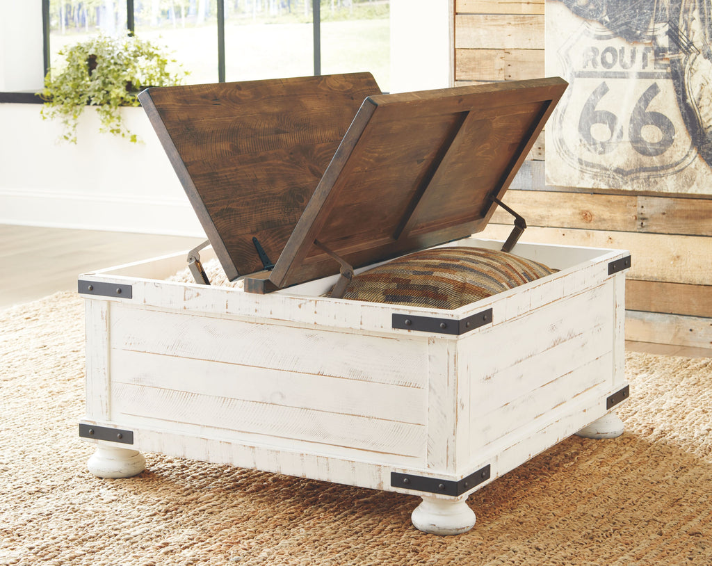White cocktail table with storage, open lid with dark wood panels and black hinges