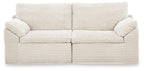 Ivory corduroy corner chair with two seat cushions and button-tufted arms