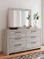 Light gray six-drawer dresser with wall mirror, six drawer fronts with black bar pulls
