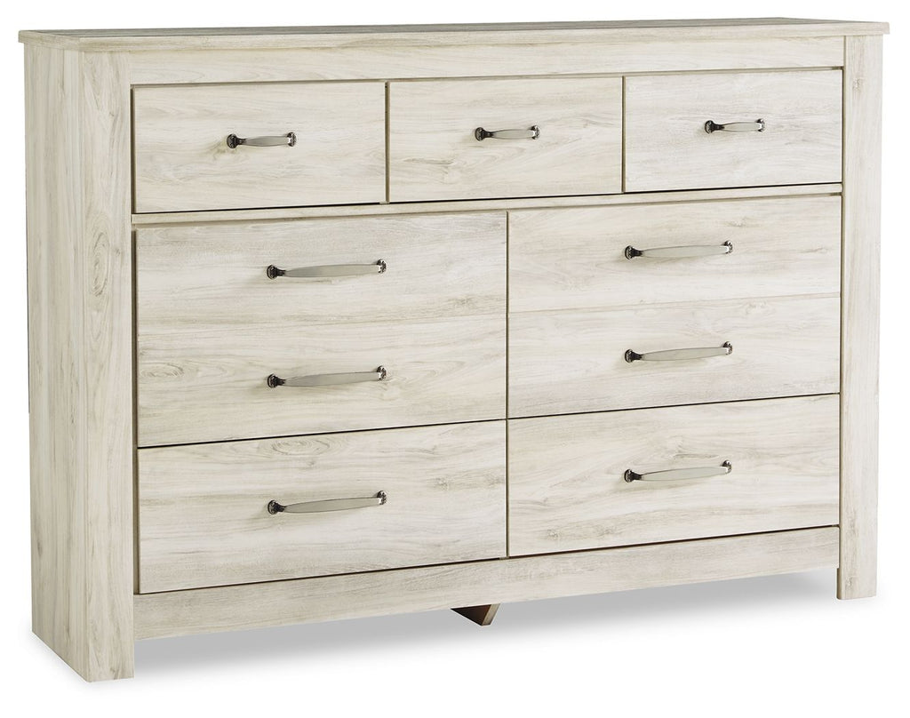 Light brown wooden dresser with six drawers and dark metal bar pulls