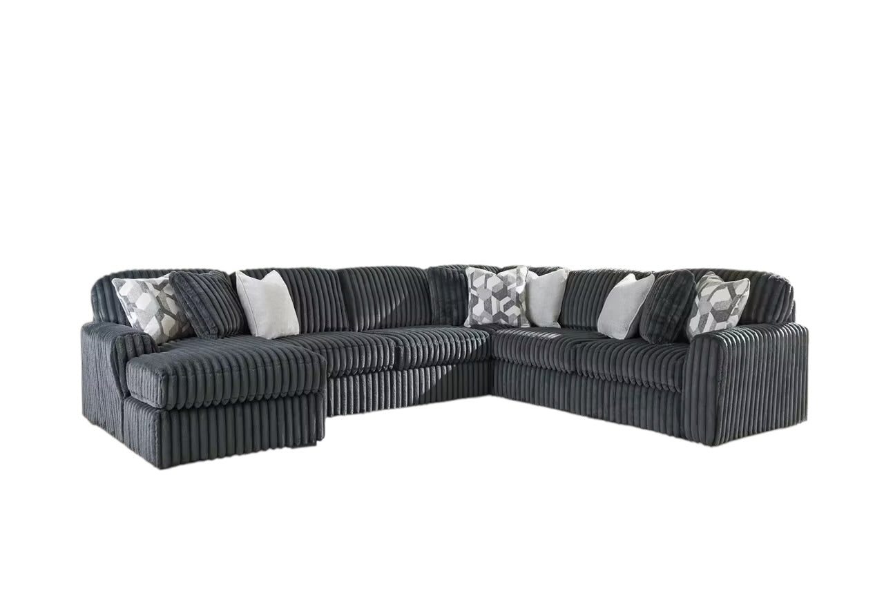 Charcoal sectional sofa with corner chaise and striped upholstery; geometric throw pillows included.
