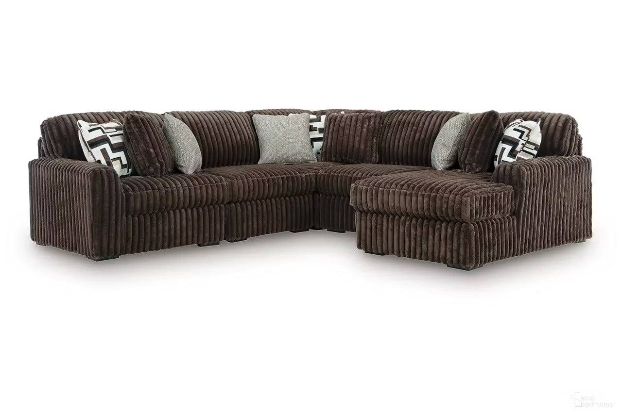Chocolate brown corduroy sectional sofa with corner chaise and patterned throw pillows
