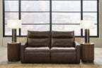 Chocolate power reclining sofa with tufted back cushions and padded arms