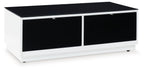 Rectangular cocktail table with white base, two black drawers, and dark top