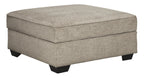 Stone beige storage ottoman with hinged lid and black legs