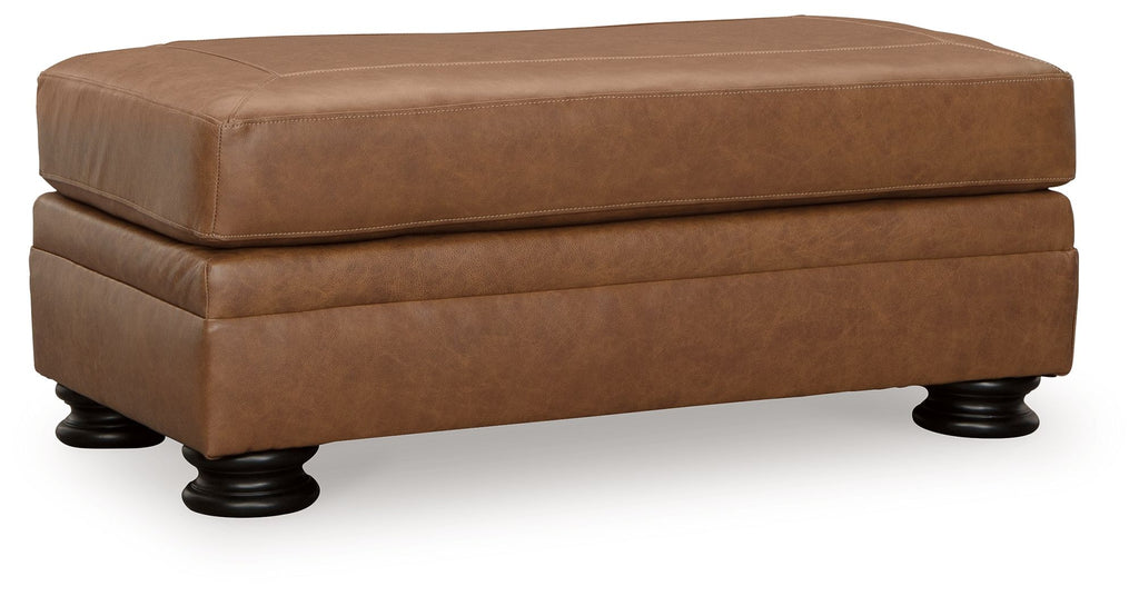 Carianna ottoman in caramel-brown upholstered fabric, split top, rounded shape, dark legs