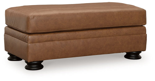 Carianna ottoman in caramel-brown upholstered fabric, split top, rounded shape, dark legs