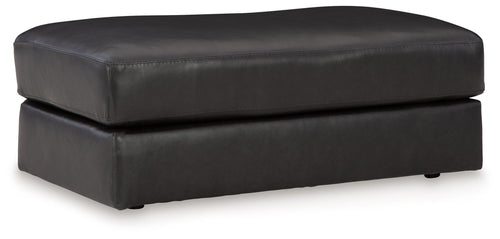 Onyx leather ottoman with padded top and squared arms, short legs