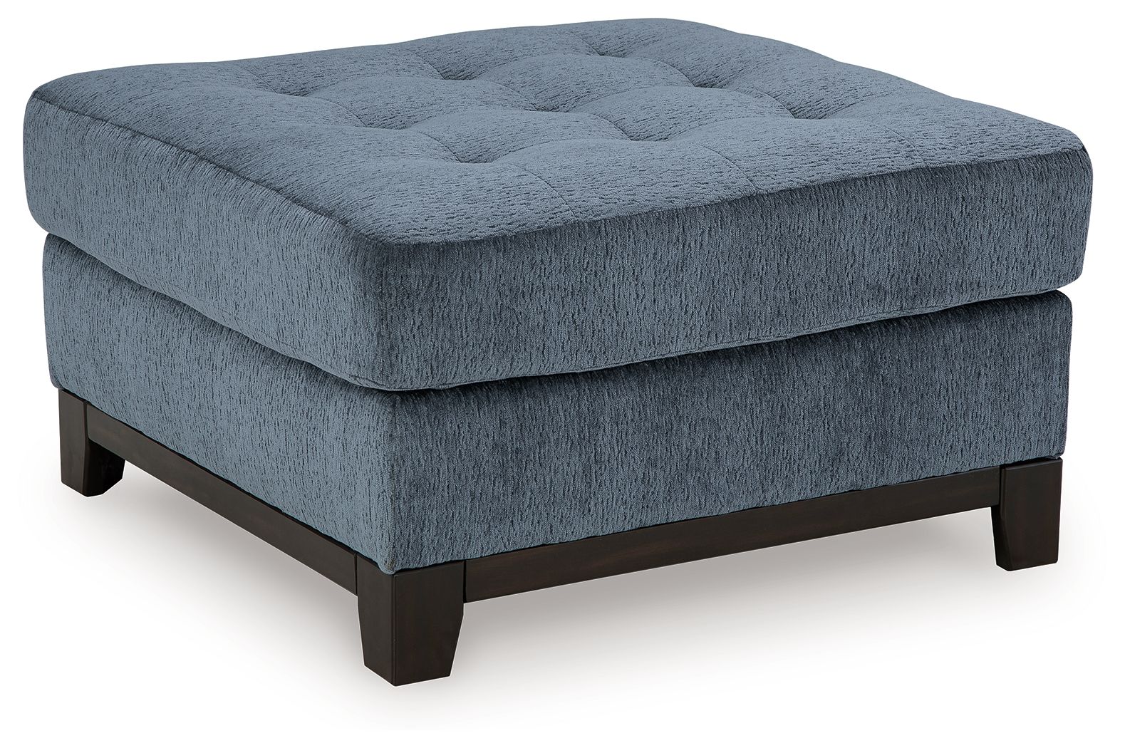 Blue oversized accent ottoman with tufted top and dark wooden legs