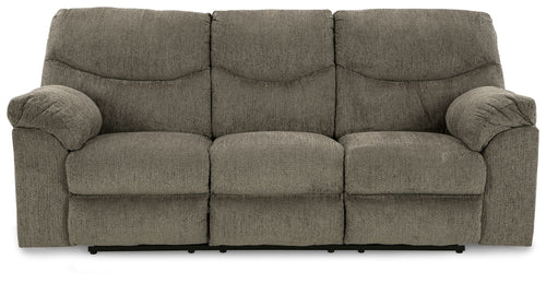 Reclining sofa in textured dark gray fabric with three seat sections and rolled armrests.