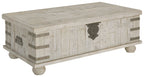 Whitewashed gray lift-top cocktail table with metal corner brackets and latch