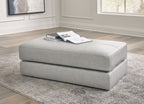 Oversized accent ottoman in pearl silver, squared cushioned top and base