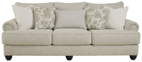 Fog three-seat sofa with light upholstery, bolster and patterned accent pillows, dark legs