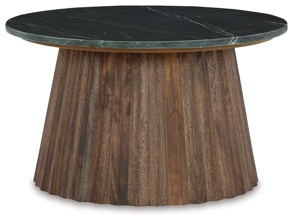 Round black cocktail table with dark marble top and brown ribbed base