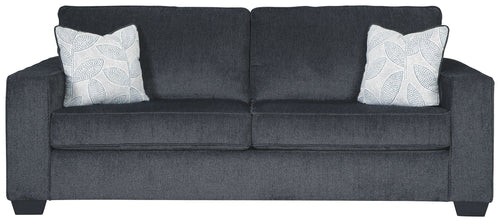 Slate sleeper sofa with two square patterned throw pillows and rolled armrests