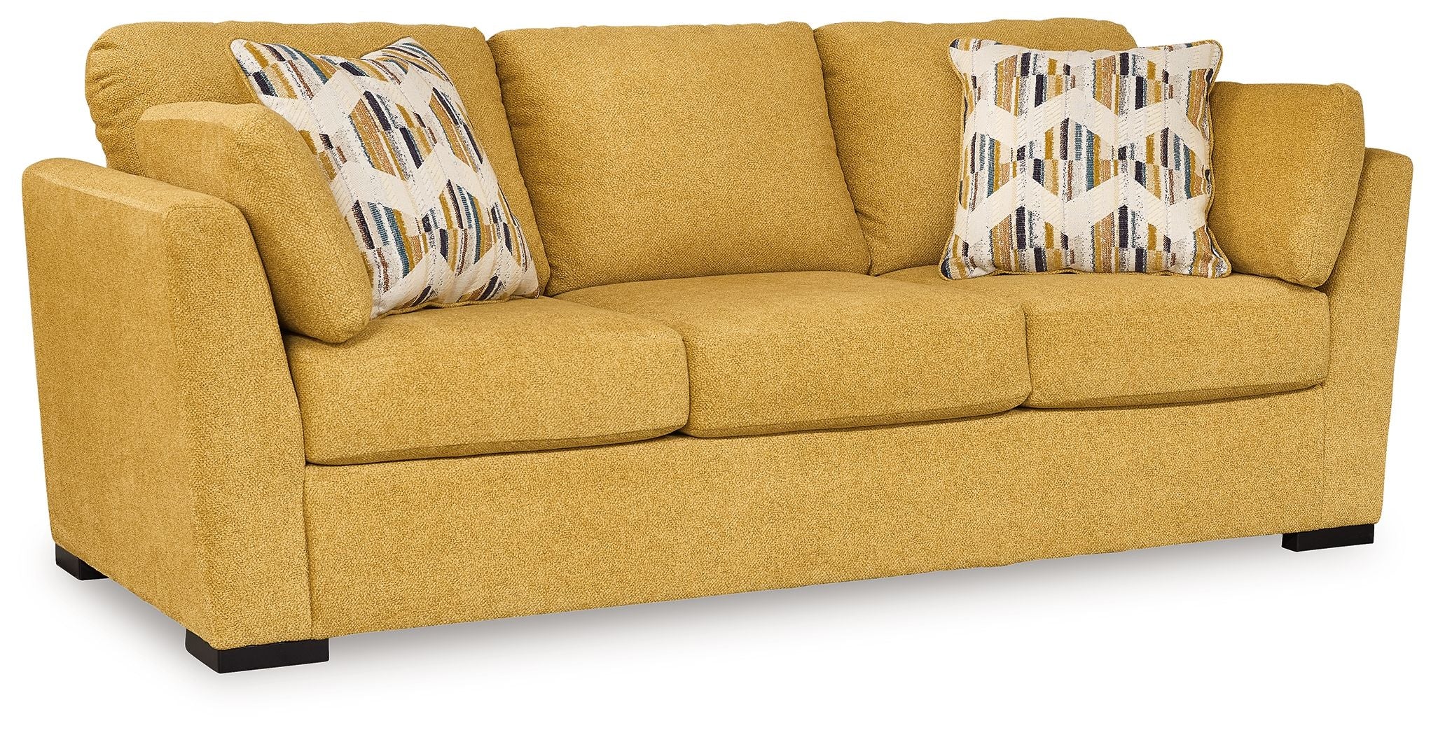 Sunflower sofa sleeper with wide arms and two patterned pillows on cushions