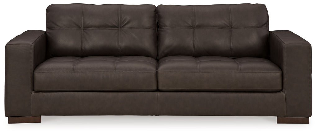 Dark brown fabric sofa with tufted back and two seat cushions