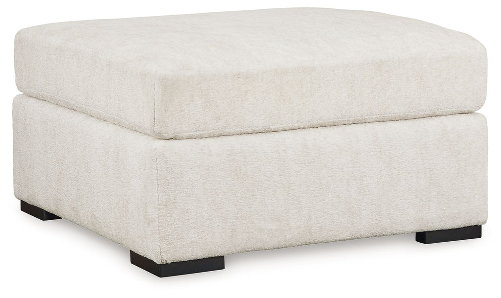Ivory oversized accent ottoman with square upholstered top and black legs