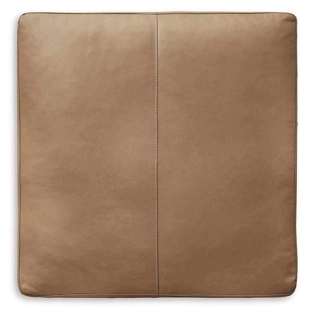 Toffee square ottoman upholstery with stitched vertical seam and rounded corners